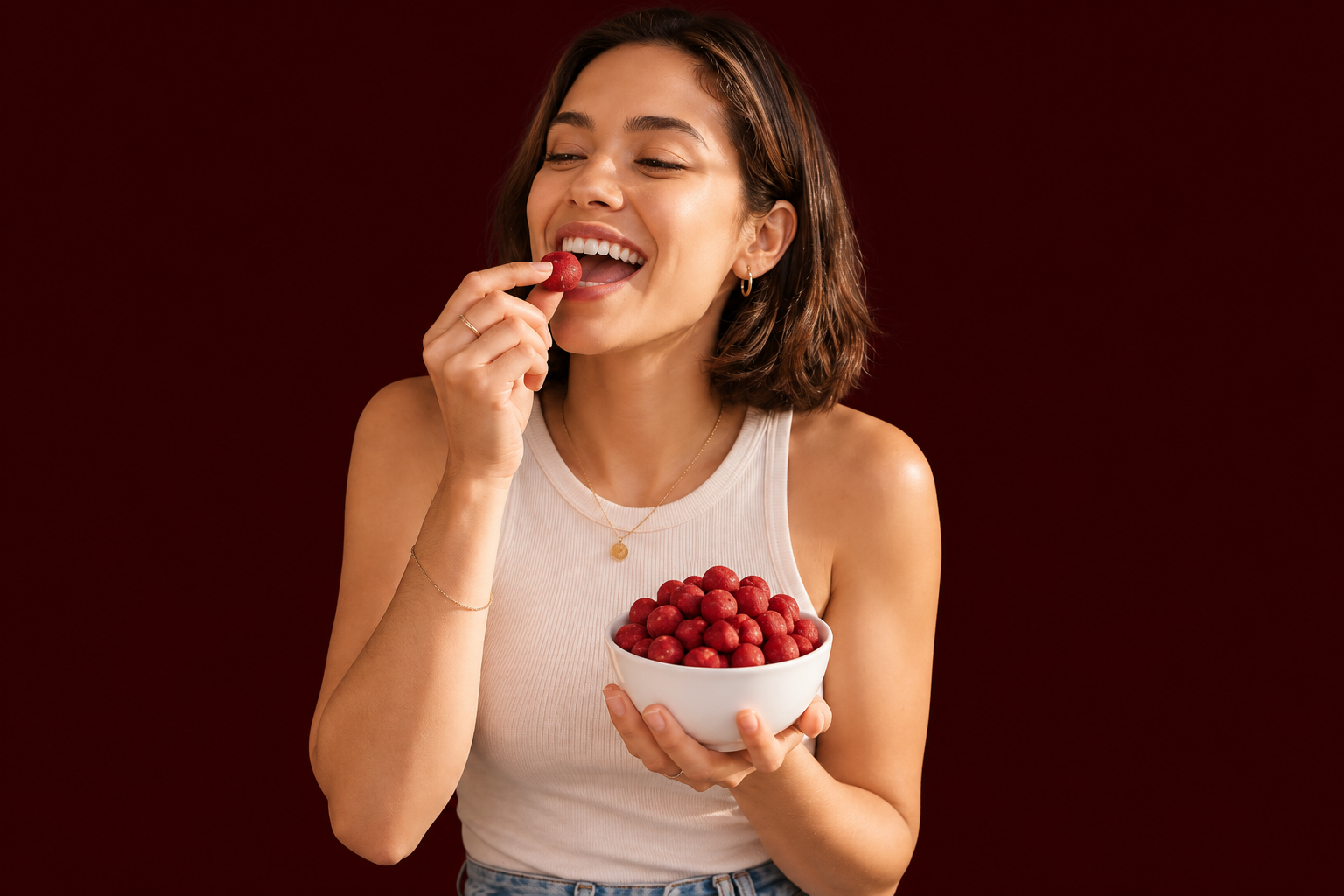 Woman enjoying Baked Bags' Red Velvet cookie dough, exploring terpenes in THC edibles.